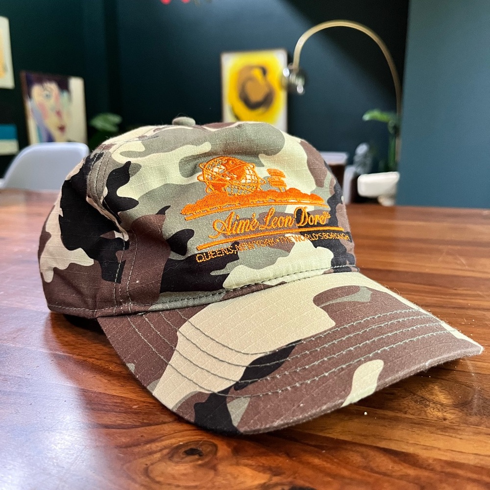 Aime Leon Dore Camouflage Cap with Orange Embroidery